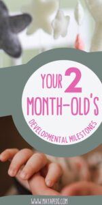 pinterest image with text reading your 2 month-old's developmental milestones www.mayapeds.com over image of a crib mobile on the top and an open infant hand at the bottom of the pin